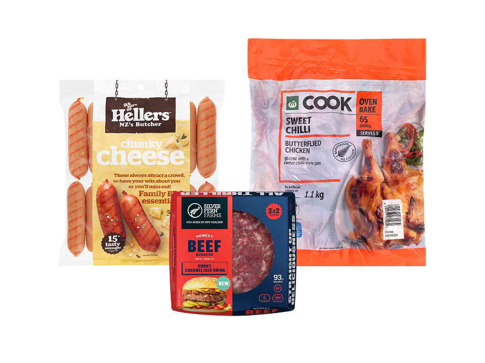 Three packaged meat items: Hellers Chunky Cheese sausages, Silver Fern Farms Beef Burgers, and Woolworths Sweet Chilli Butterflied Chicken.