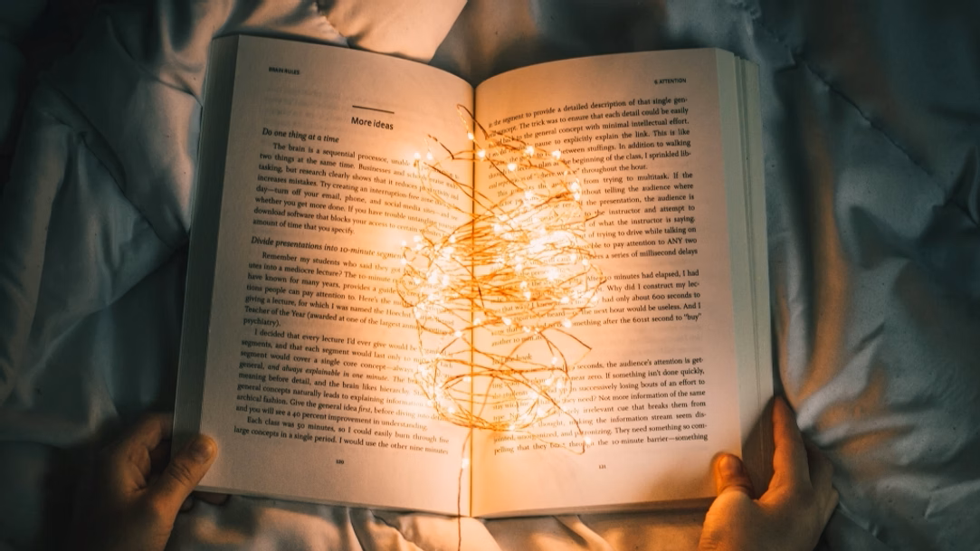 Person holding open a book