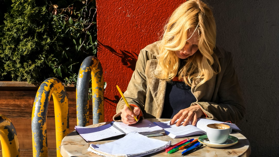 A woman studying outside