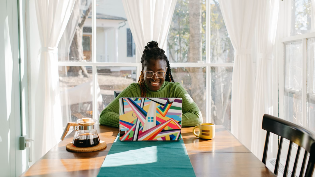 Woman using laptop at table