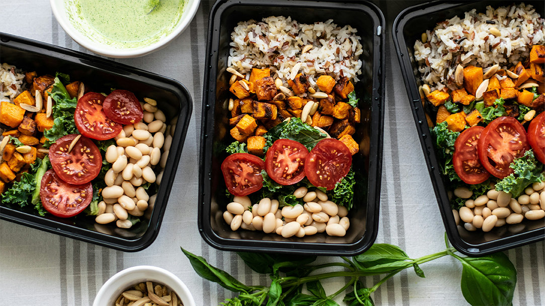 A top-down view of portioned meals prepared with help from an AI meal plan generator