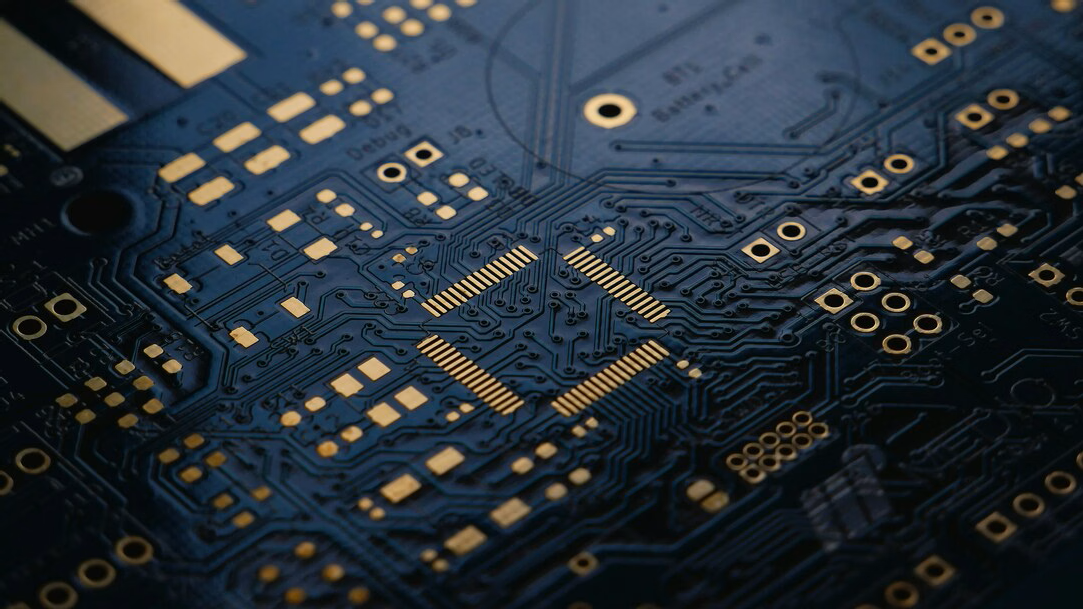  low exposure photograph of an unsoldered Printed Circuit Board (PCB) with ENIG (Gold) finish