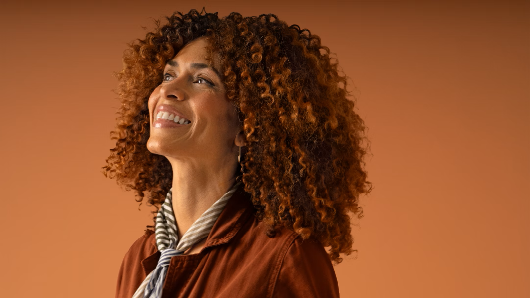 A woman smiles confidently