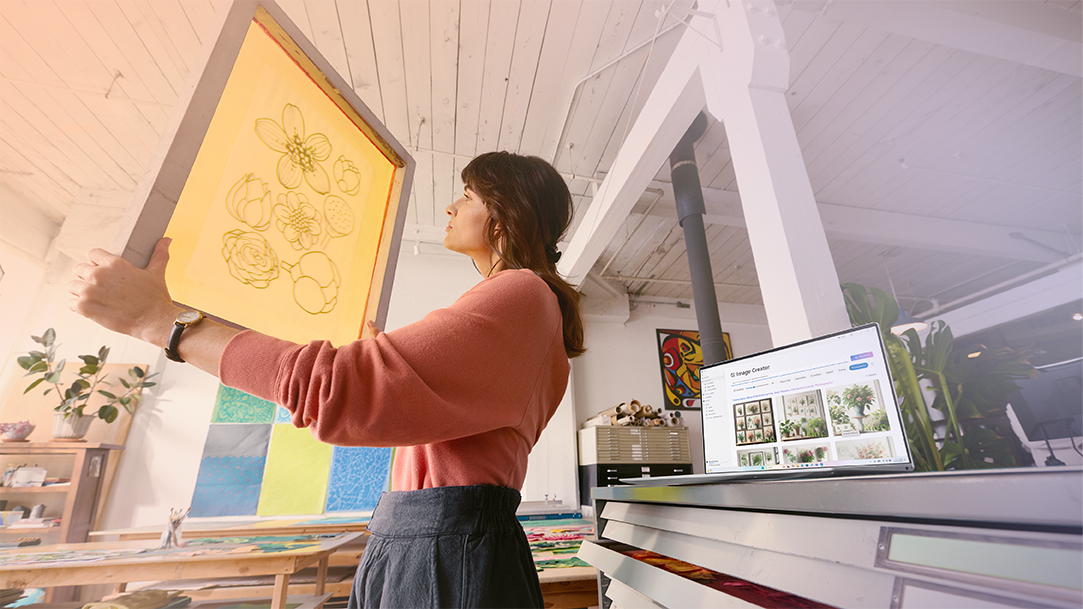 A woman reviewing artwork and working in Copilot image creator