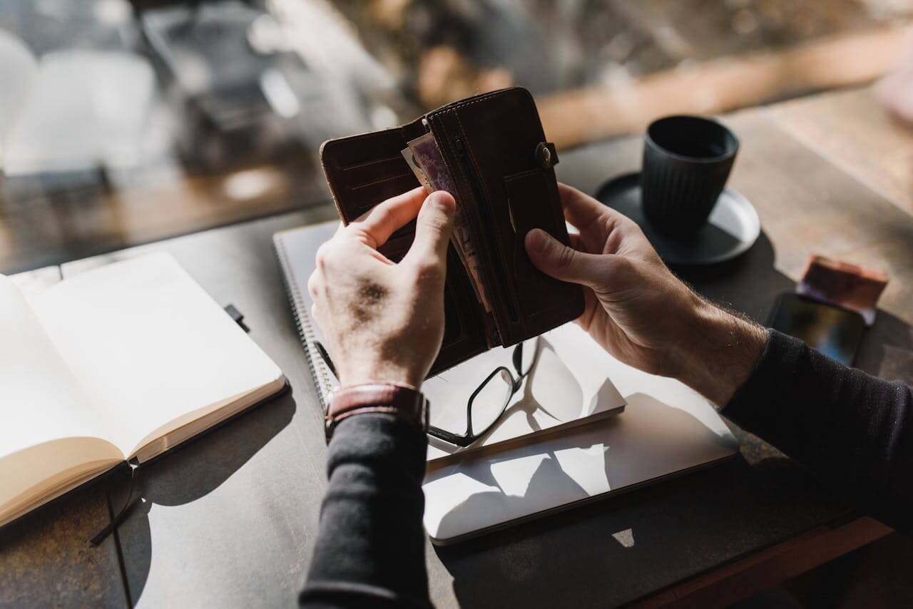 person-counting-his-cash