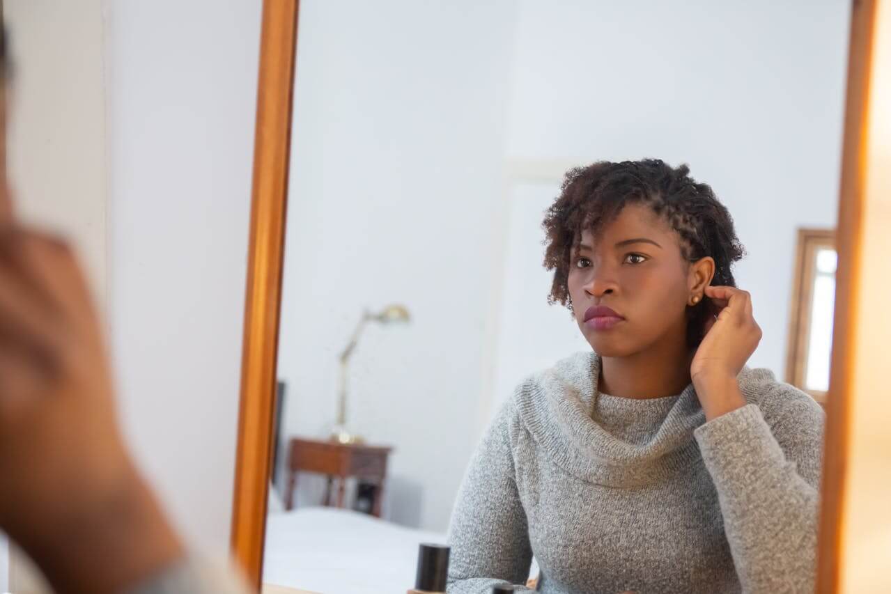 black-woman-reflecting-on-her-identity