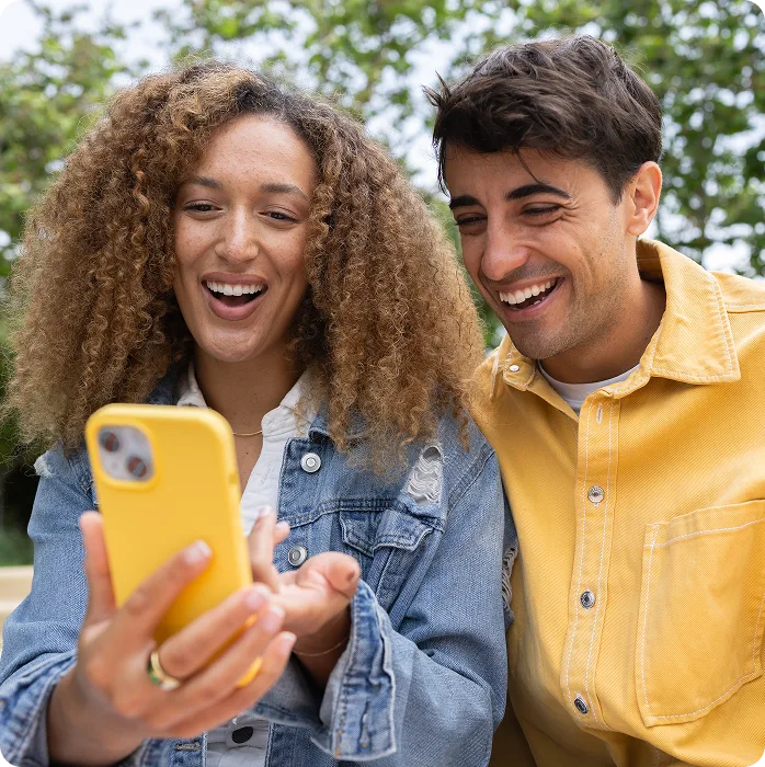 woman holding phone with friend