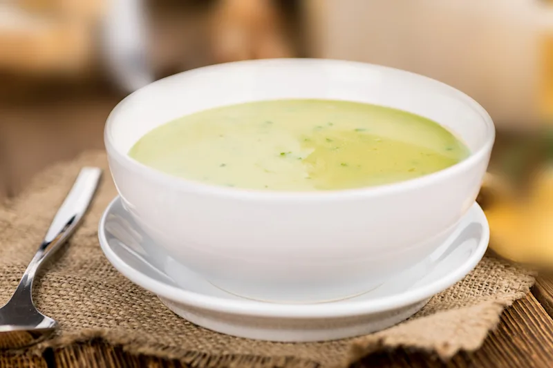 Bowl of green banana and coconut soup