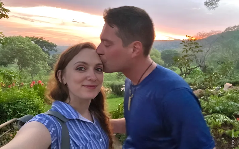 Honeymooning couple taking a selfie at sunset in Tanzania