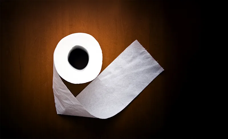 Roll of toilet paper on a dark background
