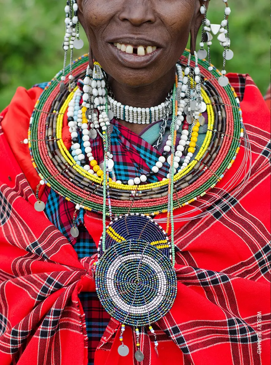 Maasai woman wearing large beaded collars and a red shuka