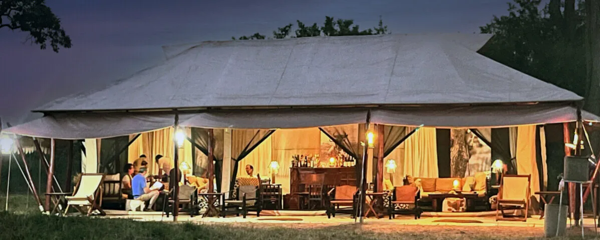 guests in lounge tent at night
