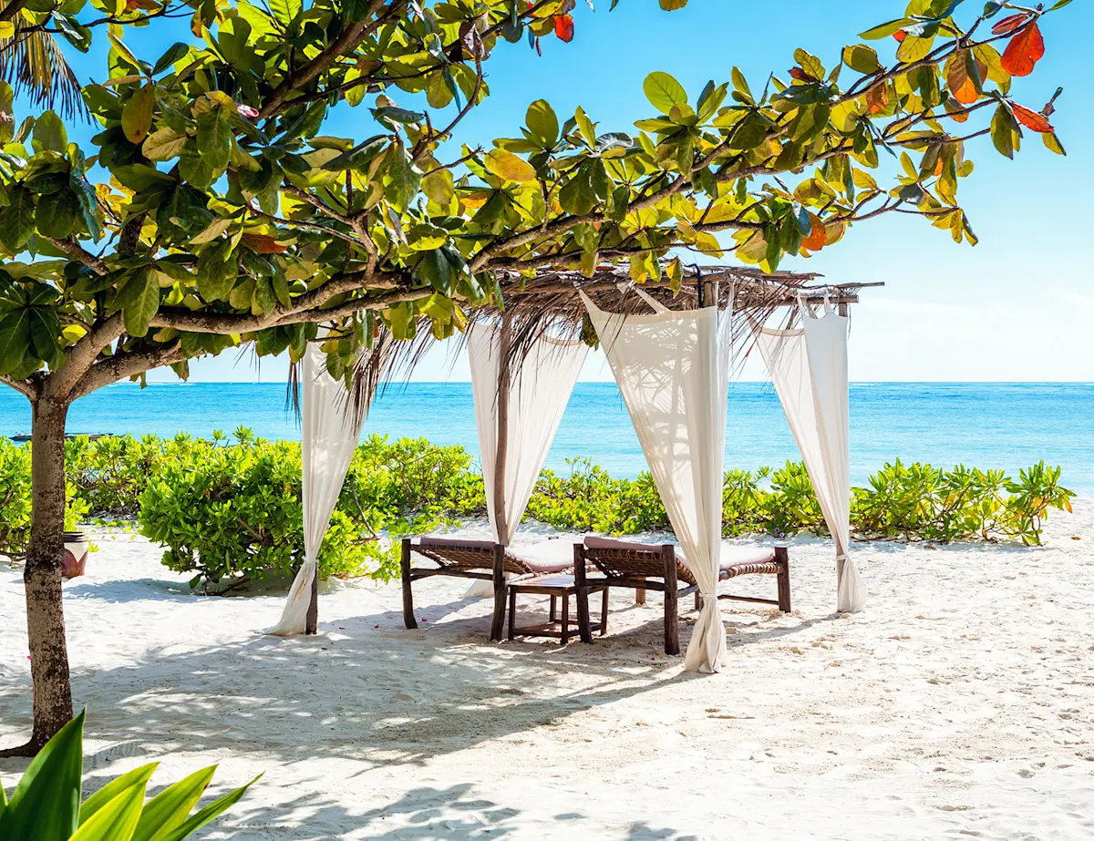 A shaded daybed above the beach in Zanzibar.