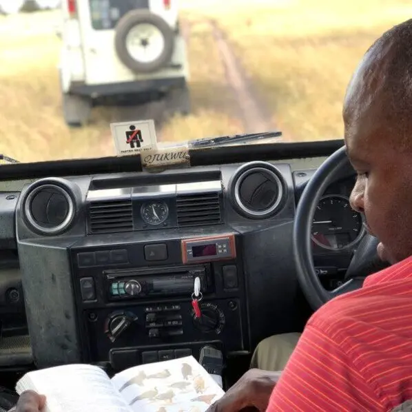 thomson safaris guide ojukwu identifies bird species