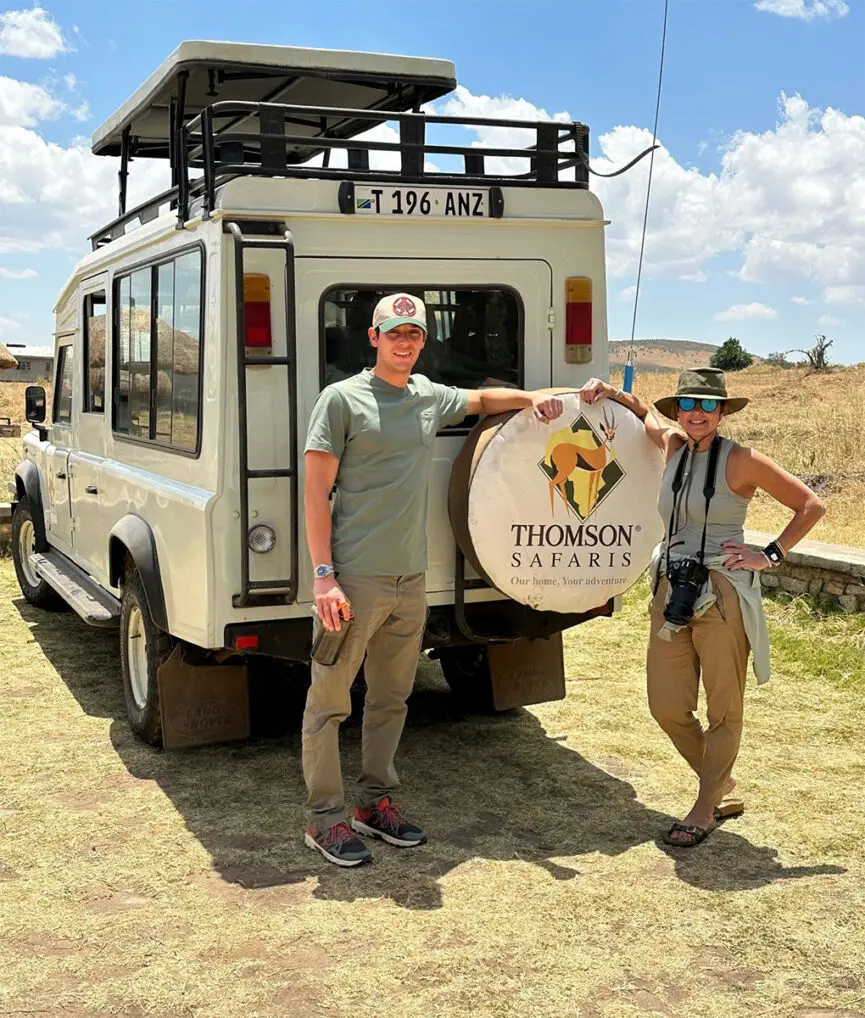 thomson guests take a wildlife viewing break from their landrover in serengeti