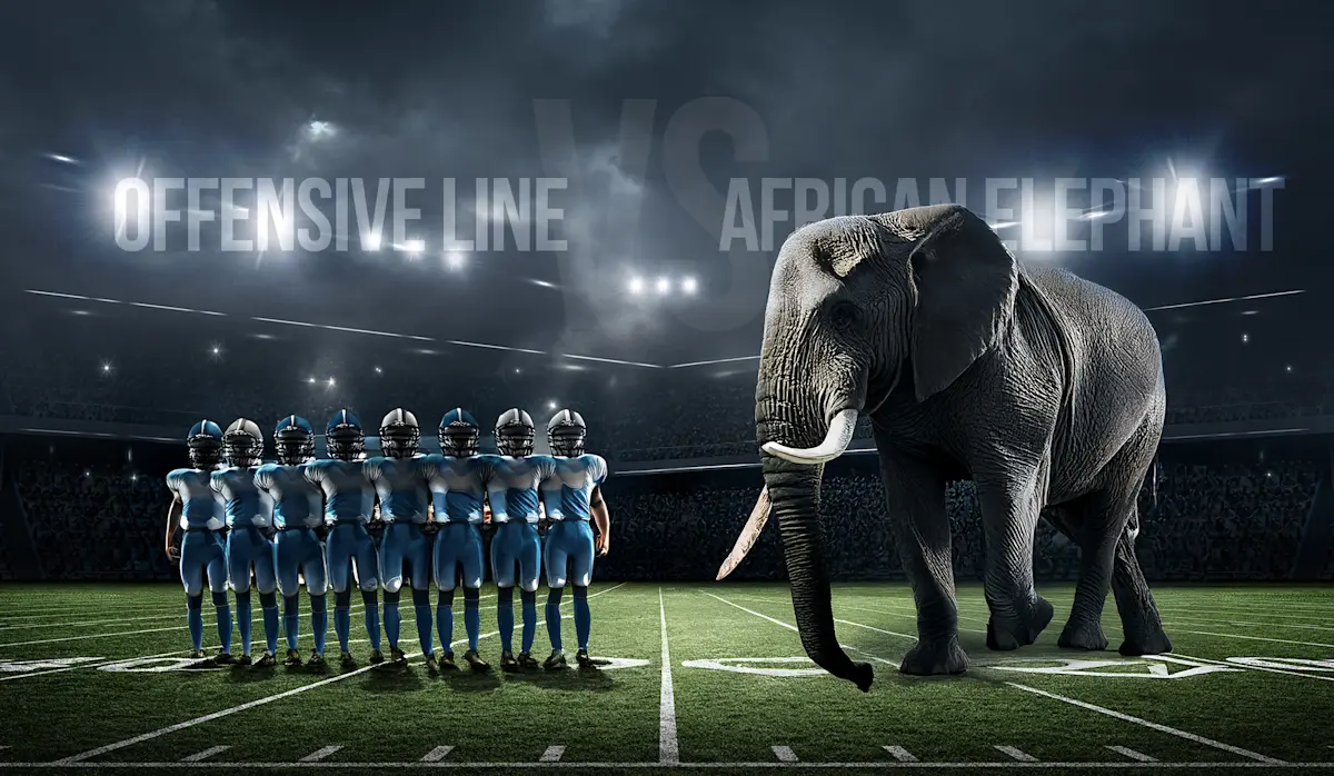 Football offensive line facing an African elephant on a stadium field