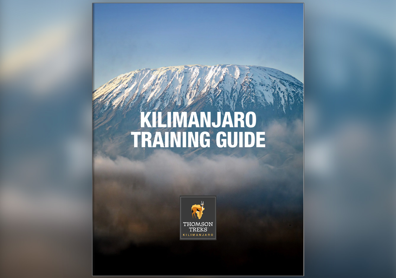 Kilimanjaro Training Guide cover showing the snowcapped summit above clouds
