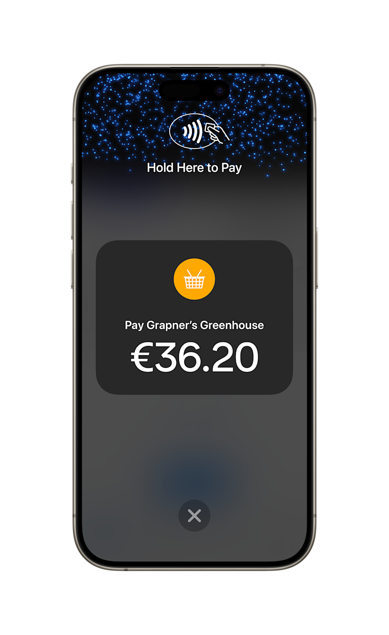 Smartphone displaying a contactless payment screen with the message ‘Hold Here to Pay’ and a €36.20 transaction to Grapner’s Greenhouse.