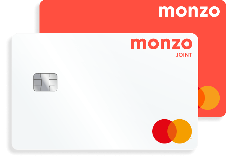 A hot coral Monzo card behind a white joint account card