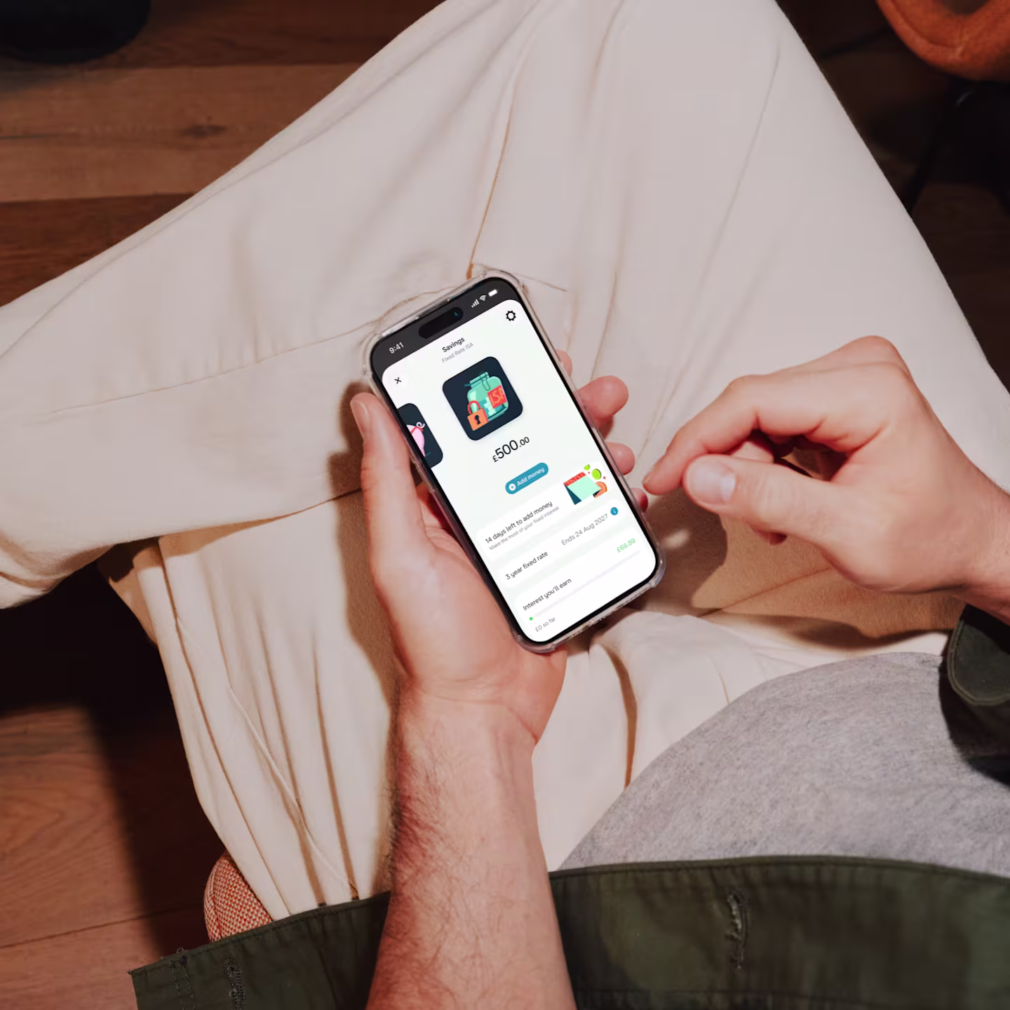 A zoomed in view of a smartphone in someone's hands showing the user interface of an open fixed rate cash isa pot.