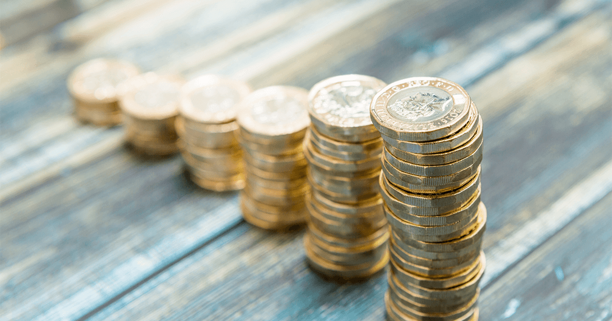 pound coins stacked in ascending stack