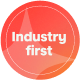 A circular, hot coral badge with the white text "Industry first" in the center.