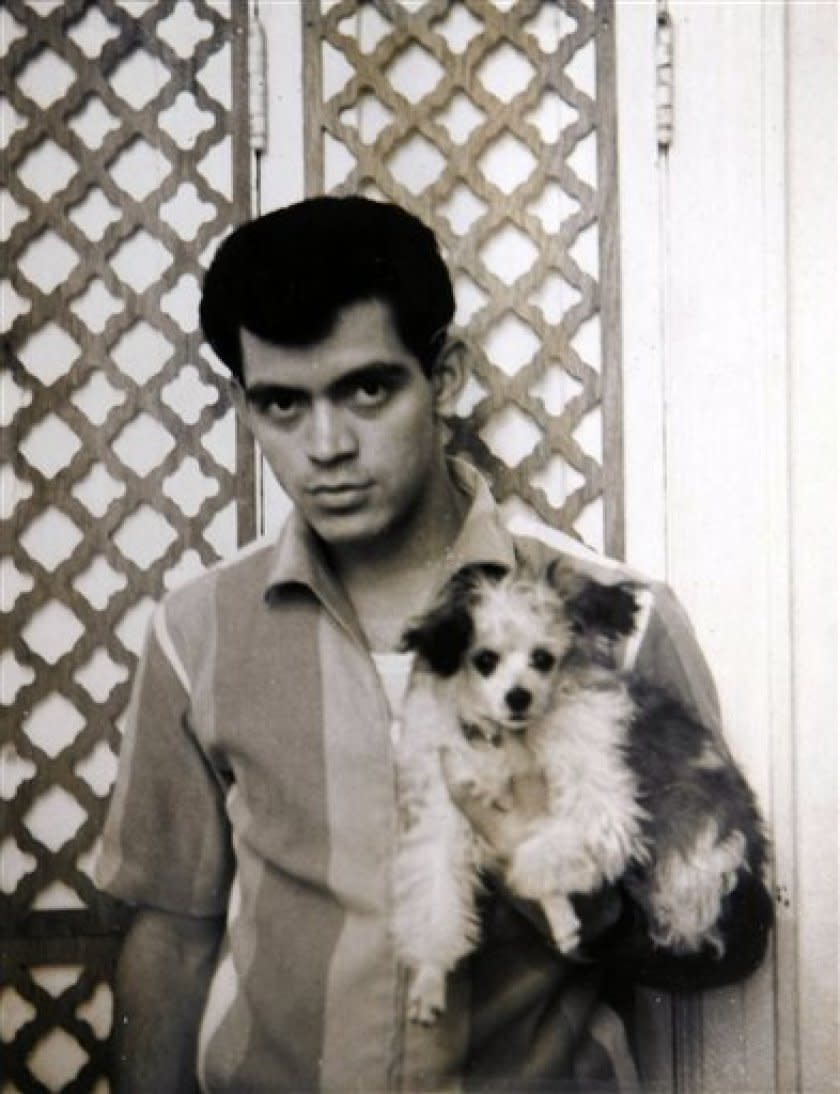 Photo of Raymond Castro holding a dog