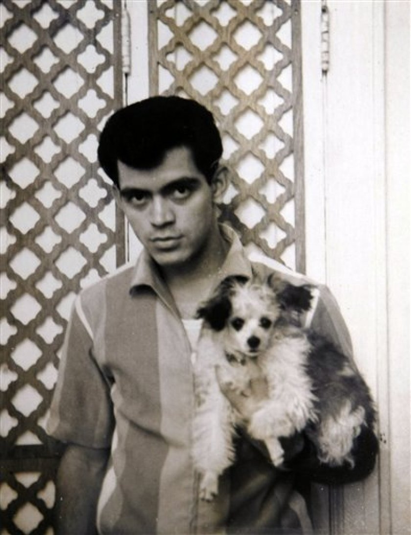Photo of Raymond Castro holding a dog