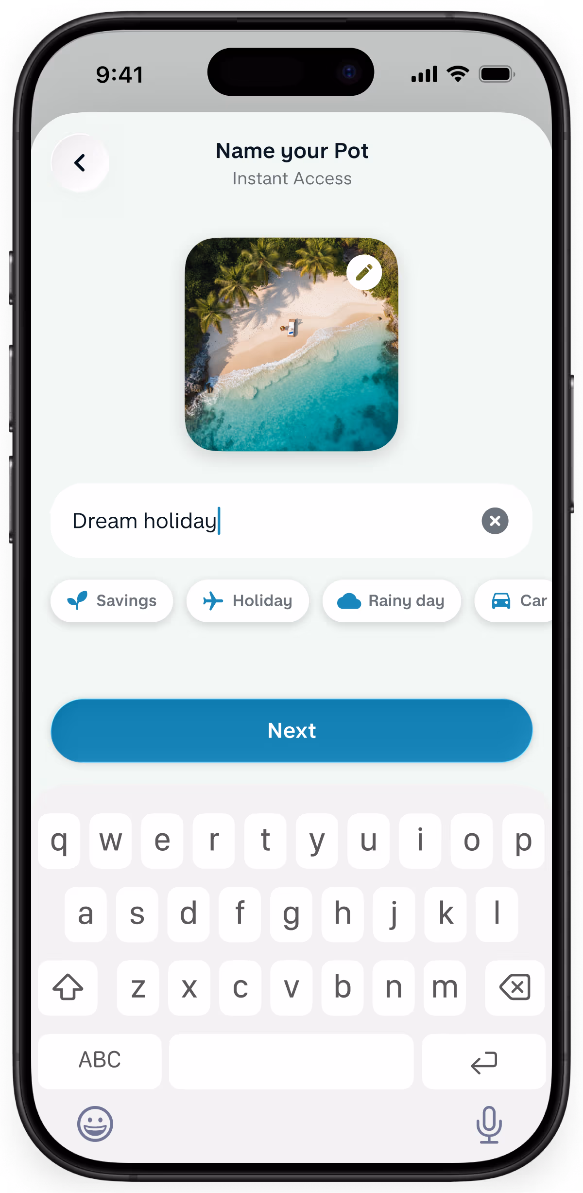 A smartphone displaying a Monzo app screen to name a new savings pot, featuring an active keyboard and a selected cover photo of a tropical beach.