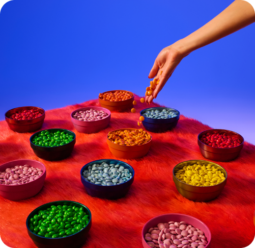 Multiple bowls with different coloured marbles