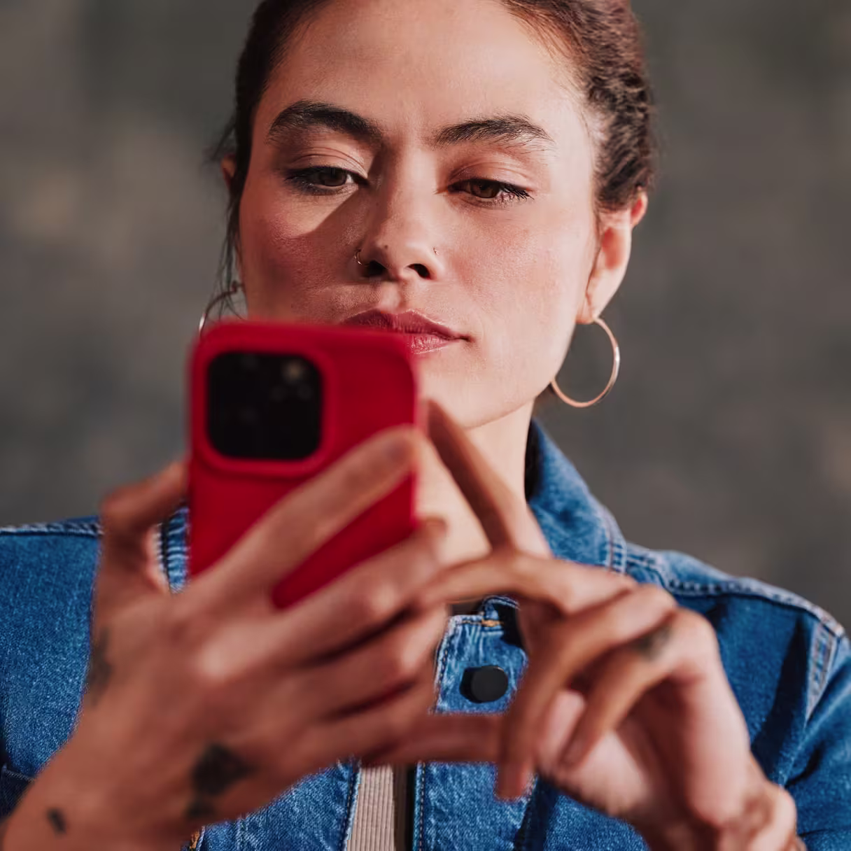A businesswoman looking at her phone
