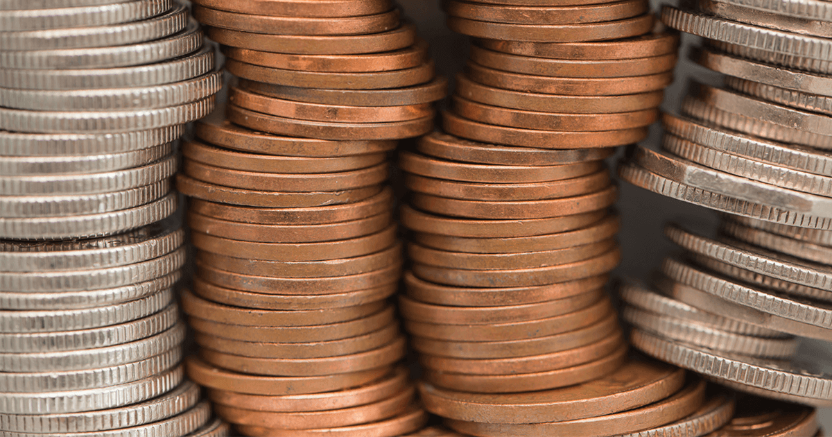 close up of pennies and coins stacked up 