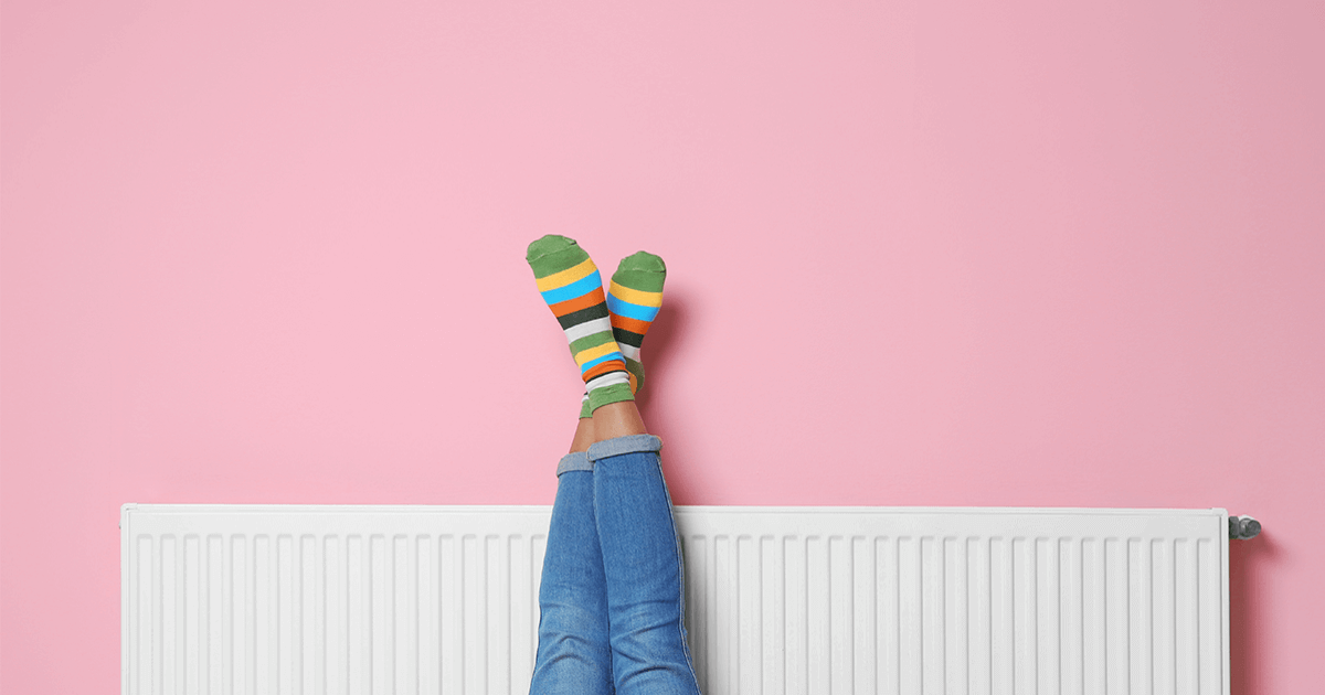 pink wall radiator girl with feet in air 