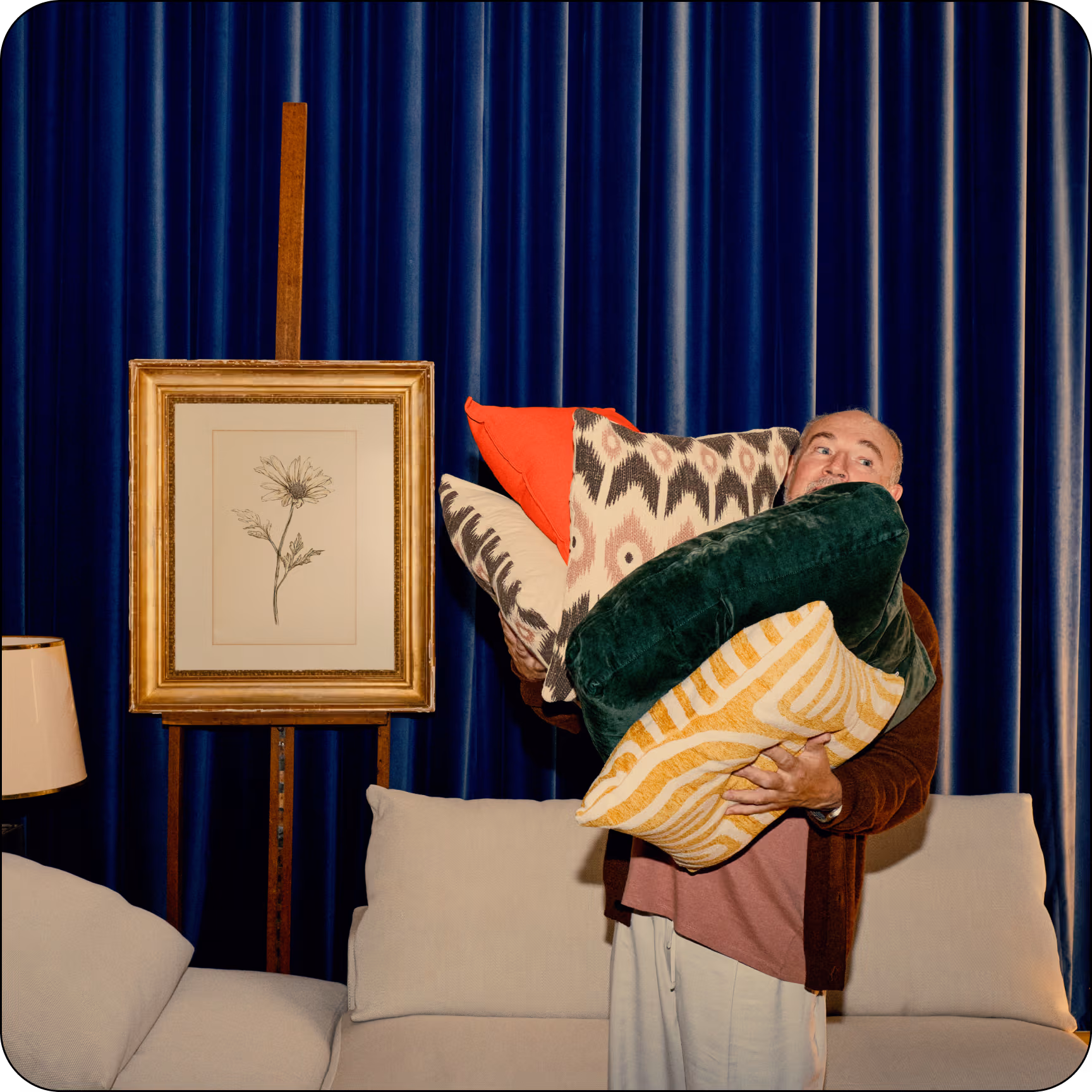 Man holding cushions