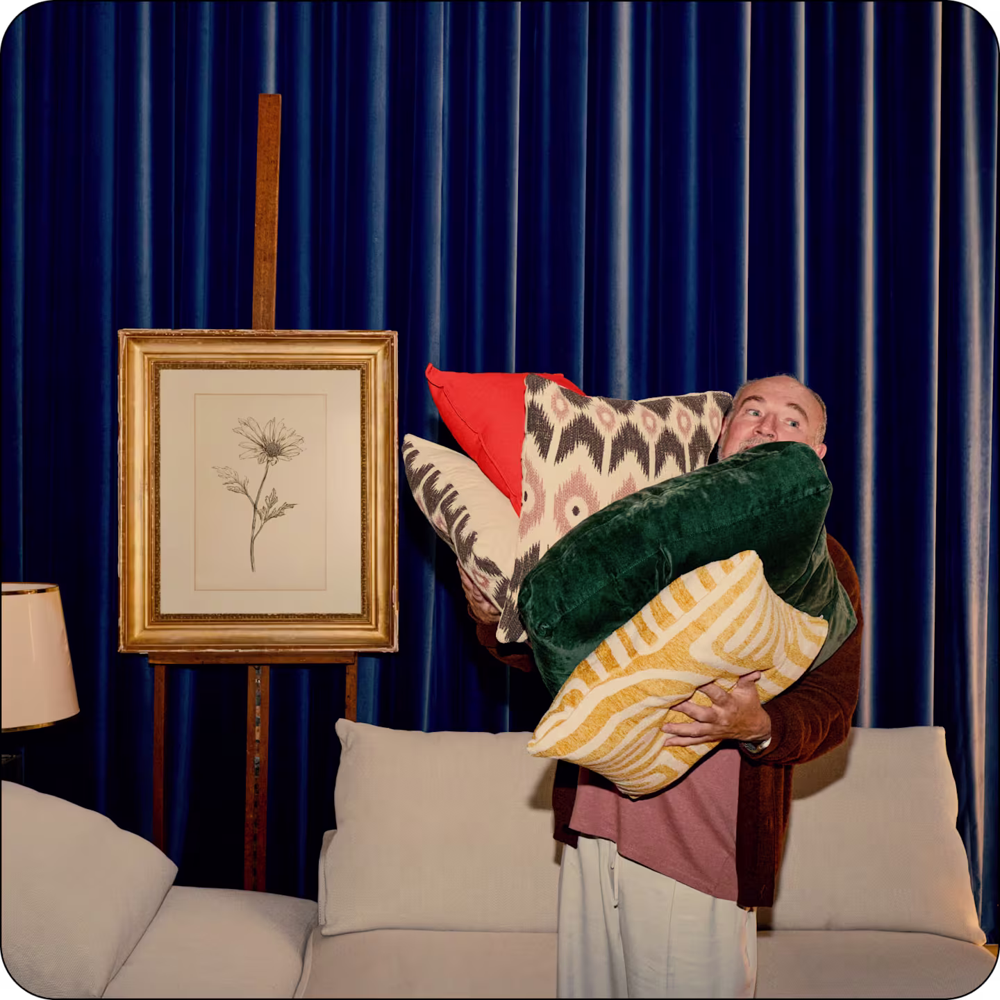 Man holding cushions