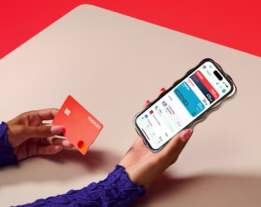 Person on phone holding hot coral card