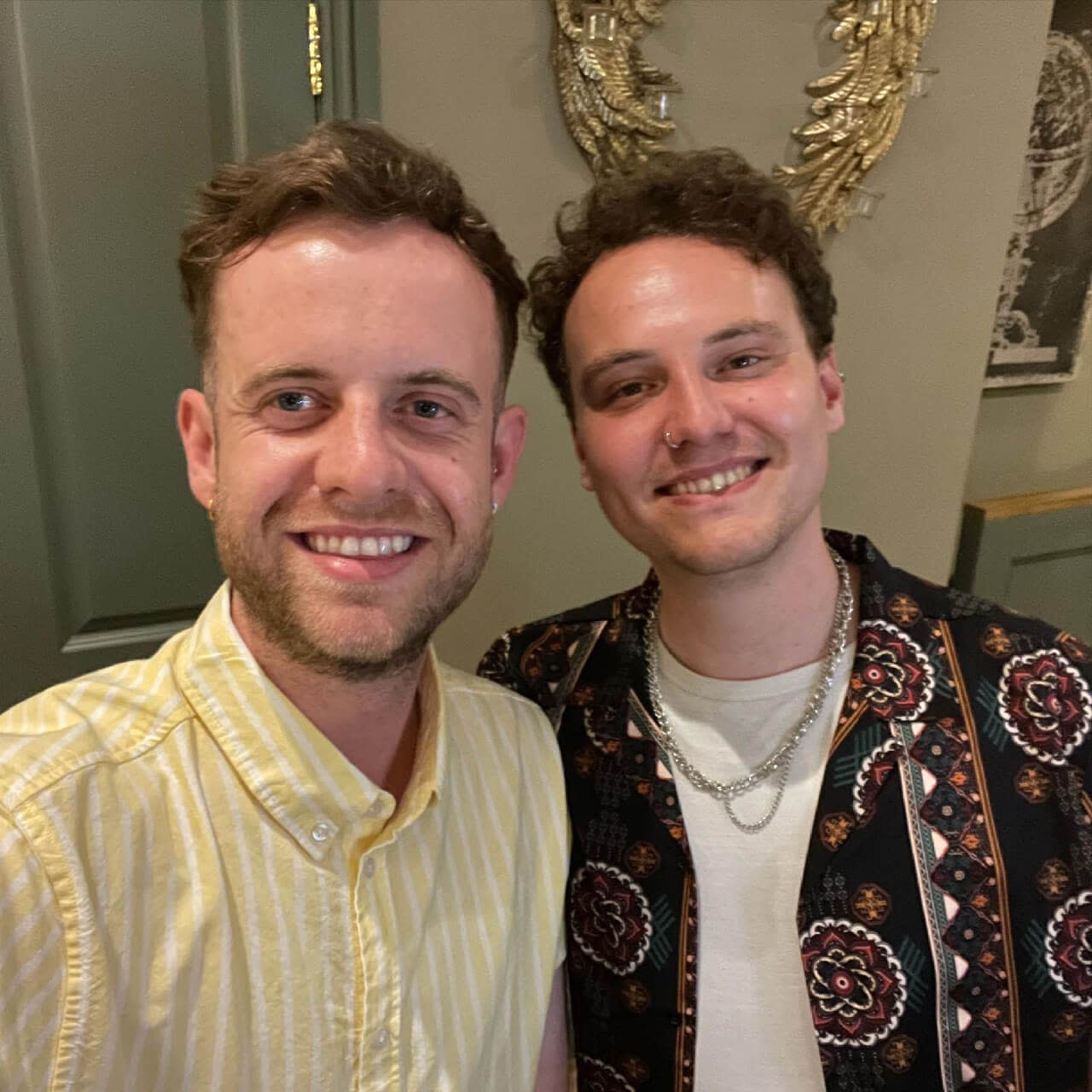 Selfie of two men wearing shirts