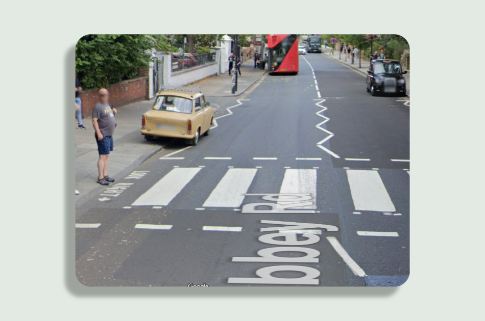 A modern day photo of the Abbey Road crossing. There are additional markings telling pedestrians to ‘look right’.