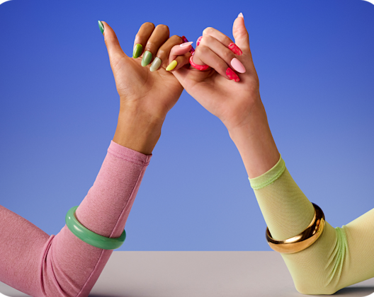 Hands with bright coloured nails – pinky fingers linking