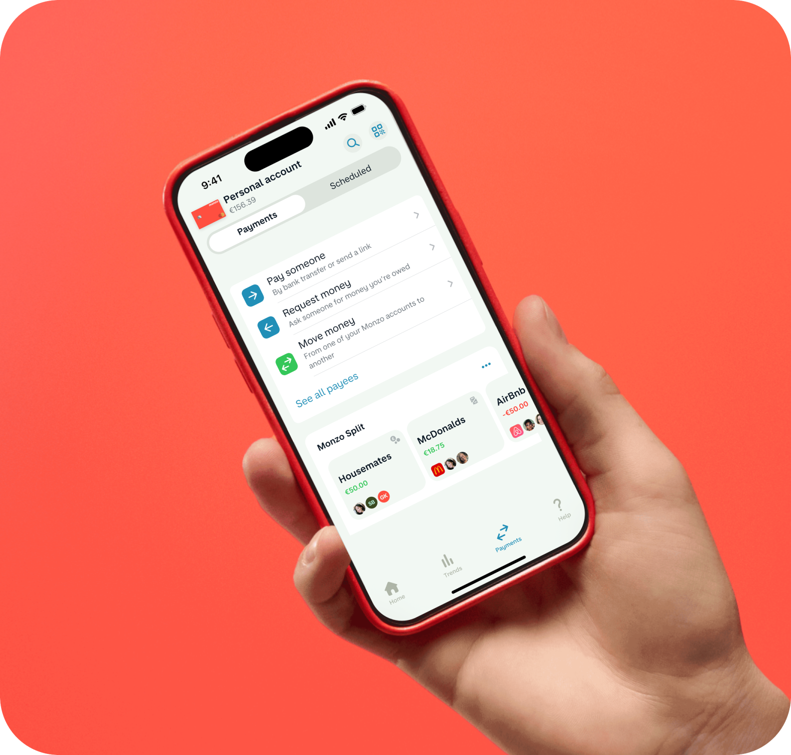 Hand holding phone on hot coral background with Payments UI. 