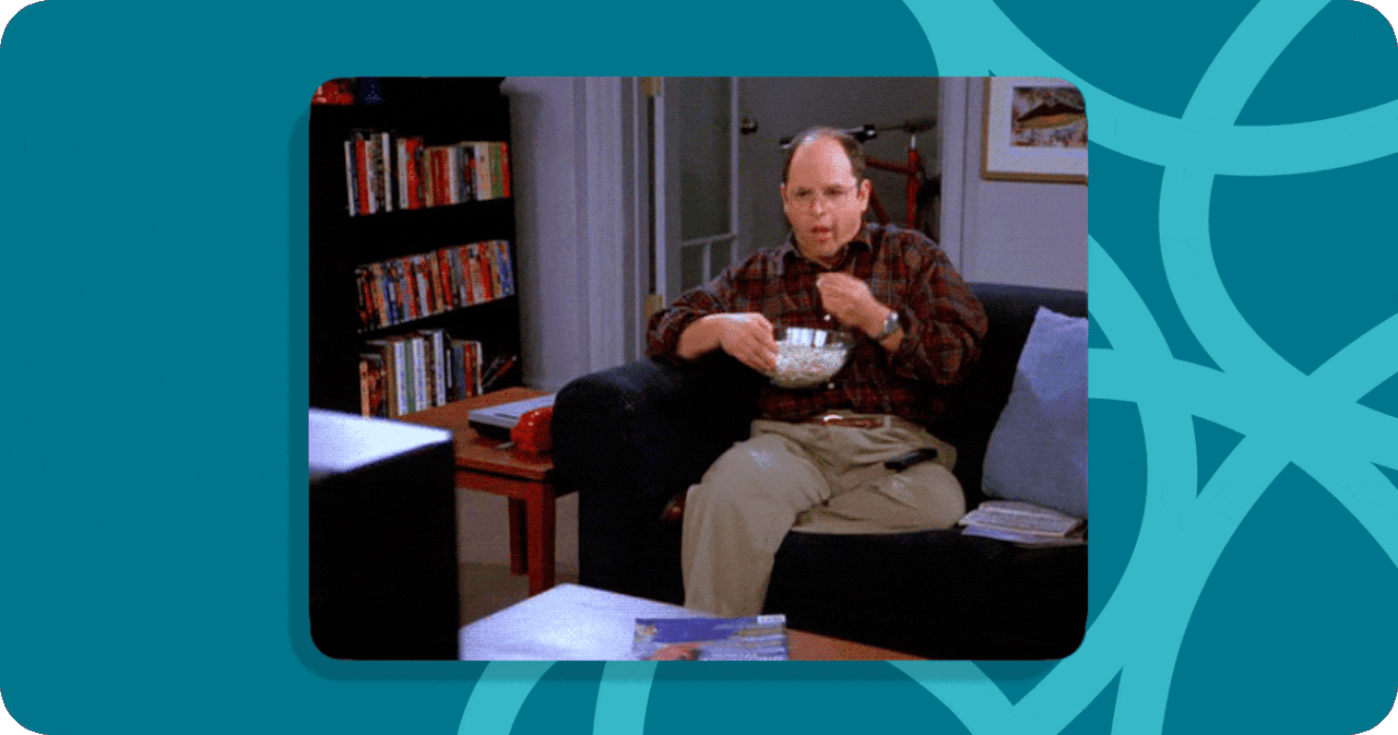 A a looping gif of George from Seinfeld eating popcorn on a couch. 