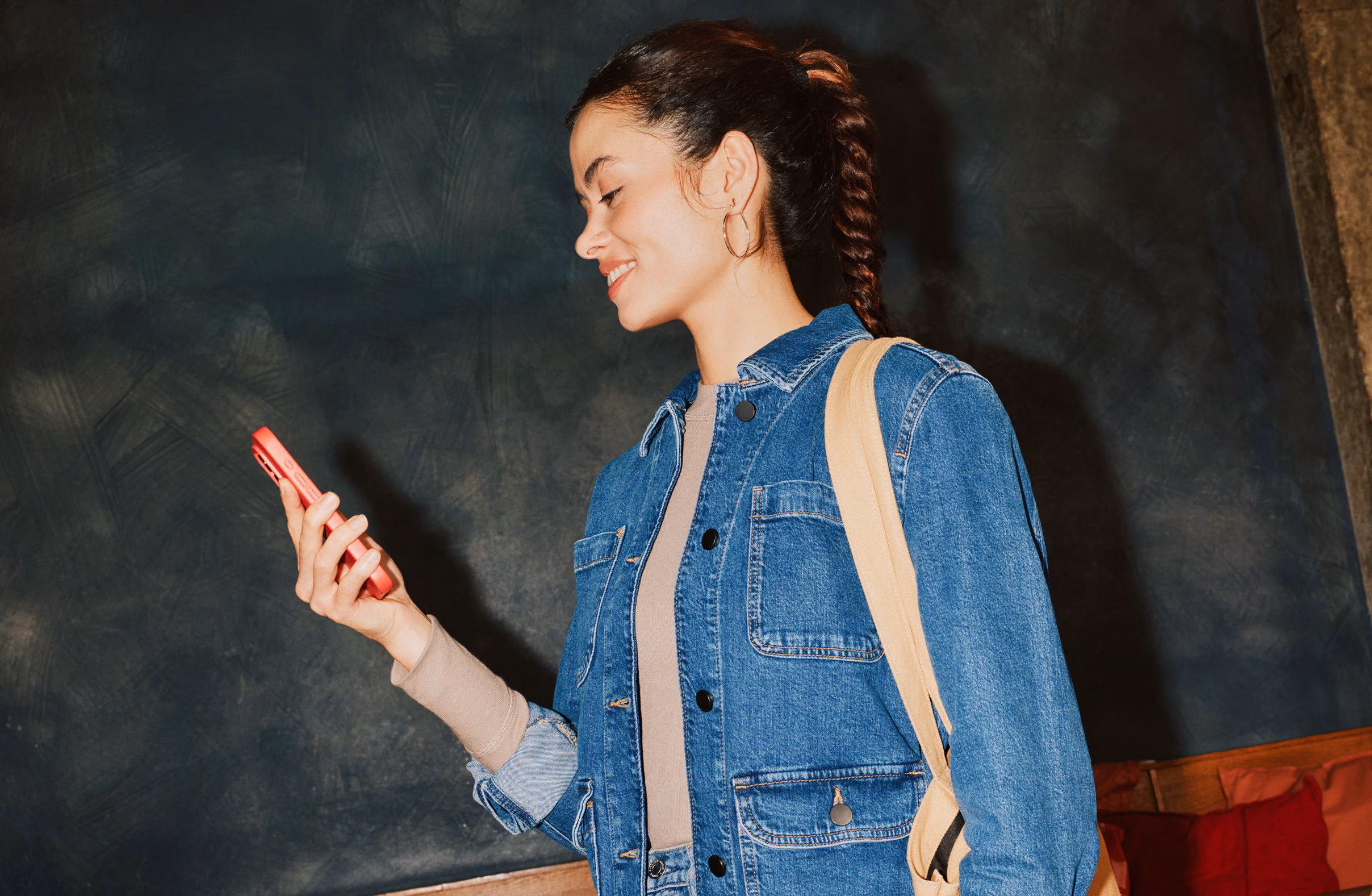 A person relaxing in a cosy setting, representing the ease of saving with Monzo