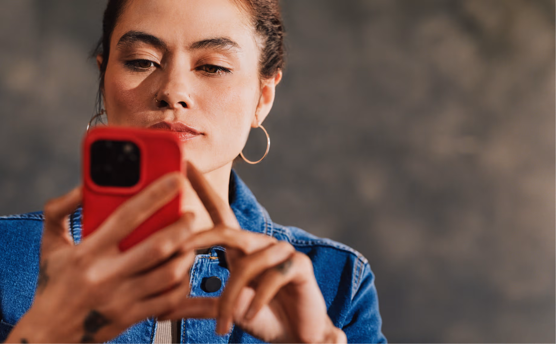 A woman looking at her smartphone.