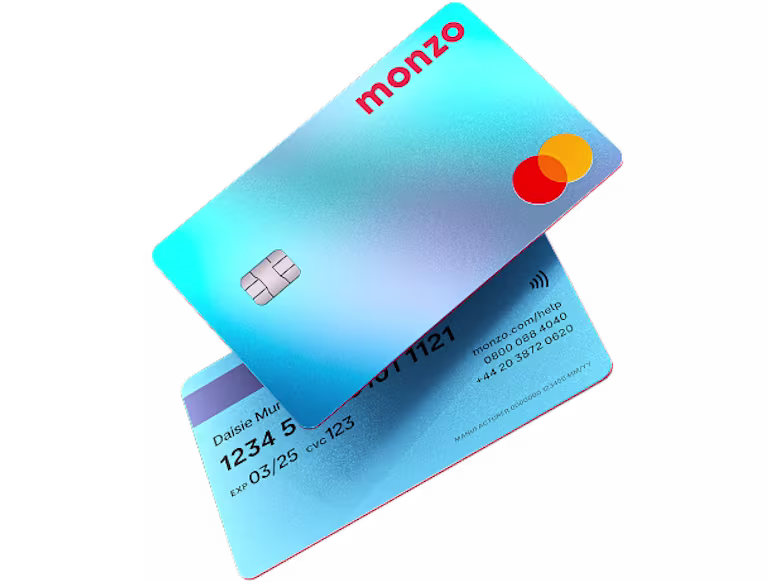 Two Monzo Perks and Monzo Max cards angled against a dark-navy background.
