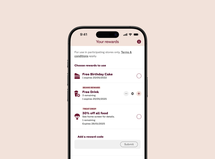 A smartphone screen showing the "Your rewards" section of a mobile app. The screen displays three reward options: "Free Birthday Cake" (expires 29/05/2025), "Free Drink" with 1 remaining (expires 29/05/2025), and "30% off all food" with 1 remaining (expires 29/05/2025). There is also a section at the bottom to add a reward code with a "Submit" button.