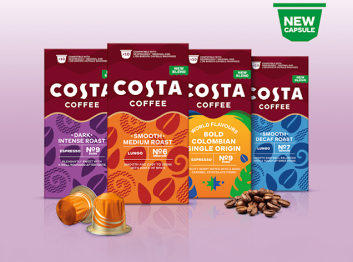 Four Costa Coffee capsule packs standing upright, each with distinct colors and labels: Dark Intense Roast (purple), Smooth Medium Roast (orange), Bold Colombian Single Origin (yellow), and Smooth Decaf Roast (blue). In front are two orange coffee capsules and a small pile of coffee beans. A green label at the top reads 'New Capsule'.
