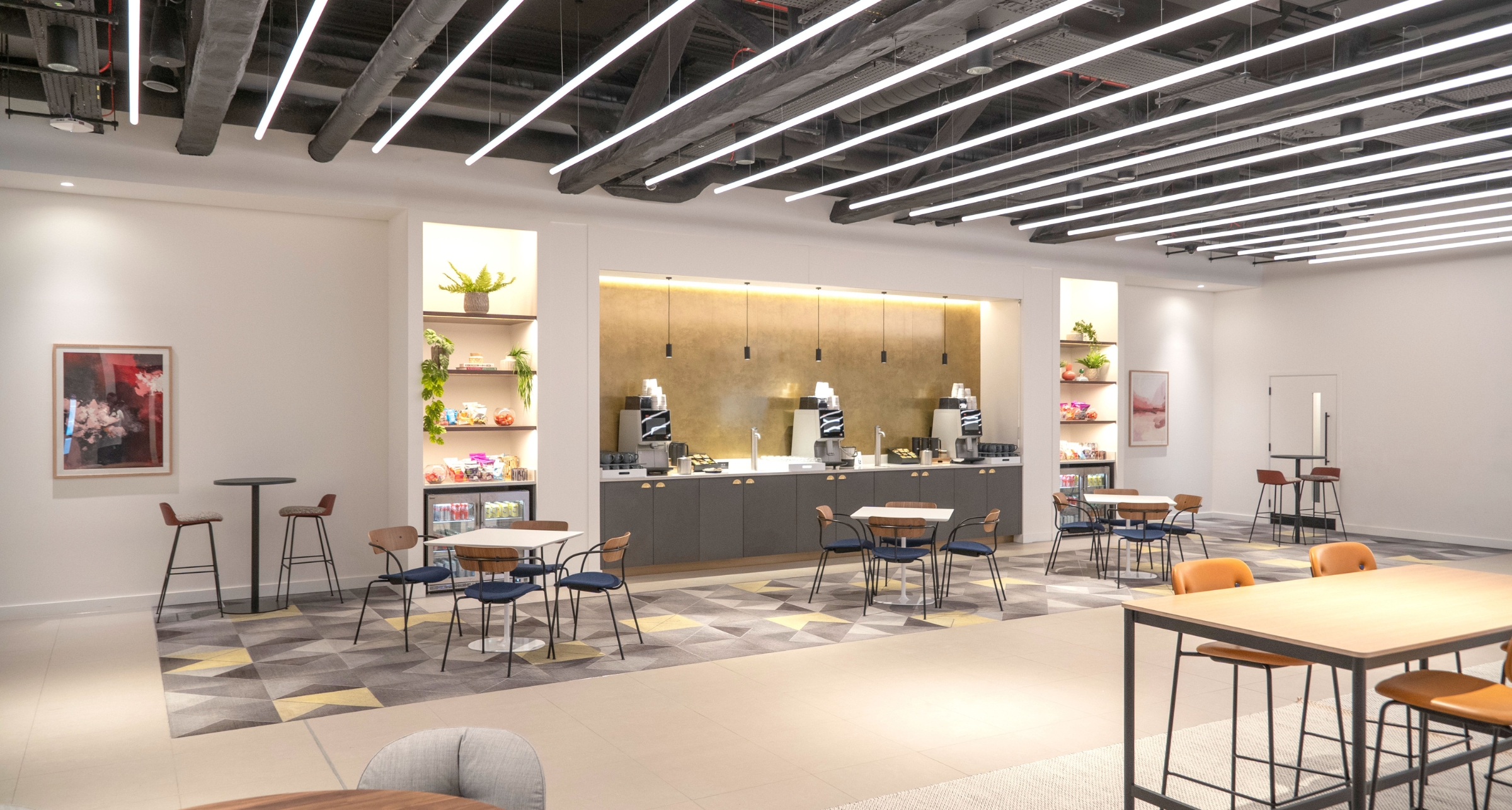 ‘Traders Lounge’ is a large open space with front desk reception, seating and nourishment stations. 