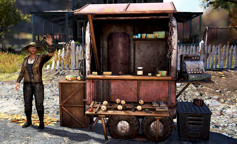 A person stands beside a rusty vendor cart with cans, jars, and a cash register, set in an outdoor area with a white fence, trees, and a swing set.