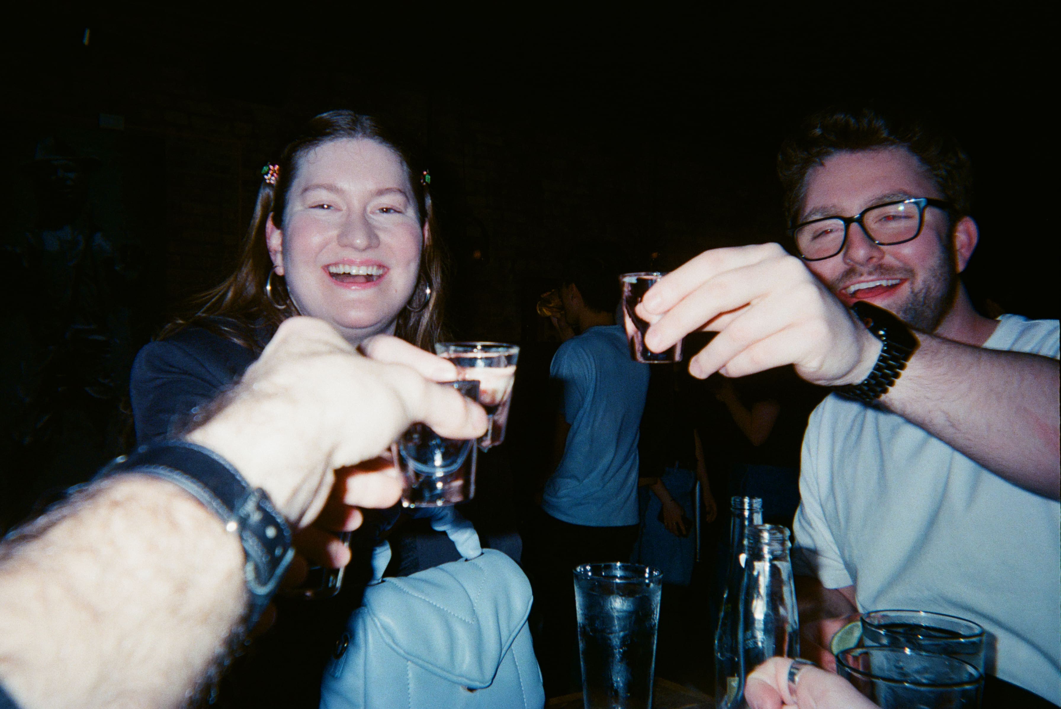 A group of people holding glasses.