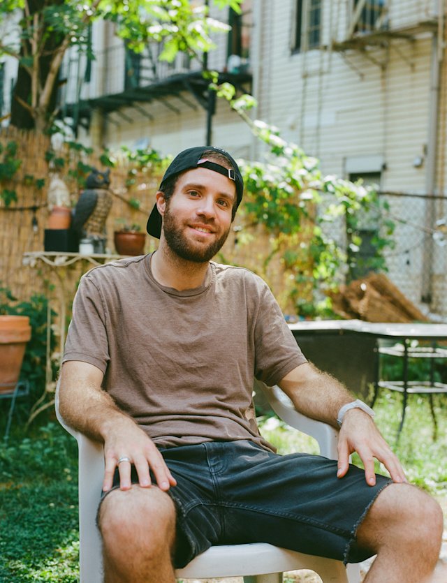 Dan sitting in a backyard.